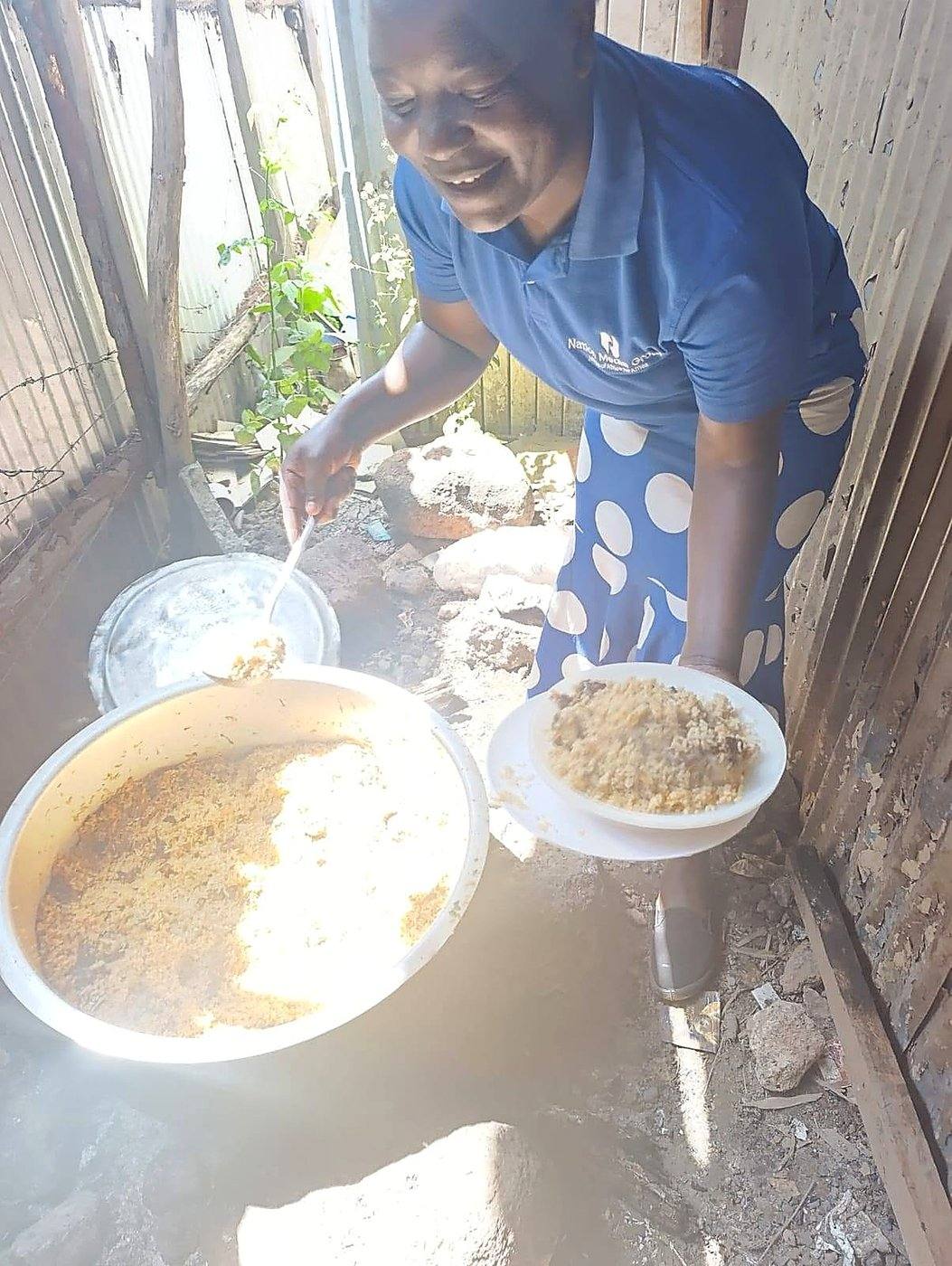 Dishing out food during a GCIG relief programme