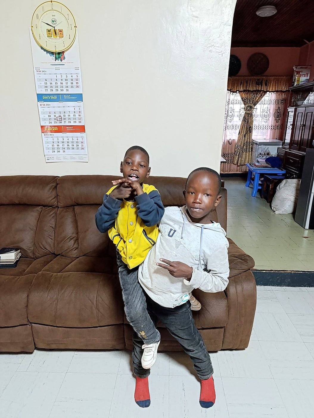 A father and child smiling at a GCIG gathering
